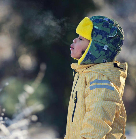 Child wearing green winter hat