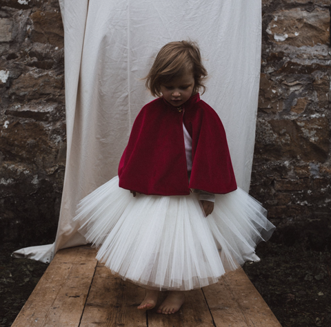 Child Wearing Fable Heart Red Capelet 