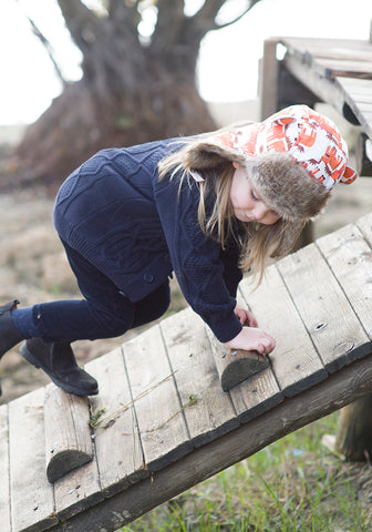 child climbing in little hotdog watson winter hat