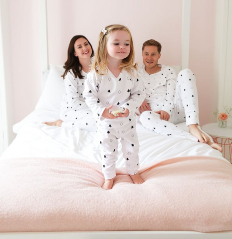 Family wearing matching christmas sleepwear by Didi and Bud