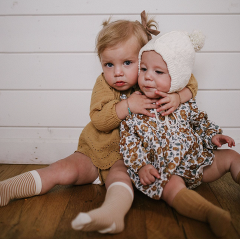 Two children wearing Sisi and Seb clothing