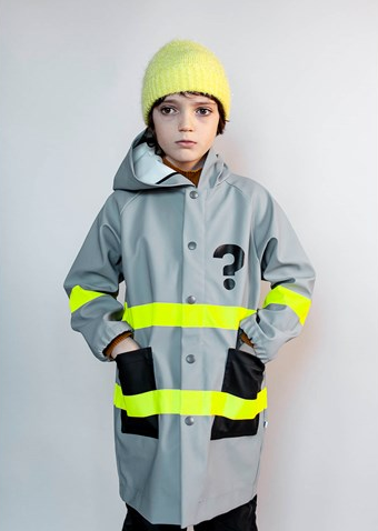 Child wearing grey and yellow striped raincoat