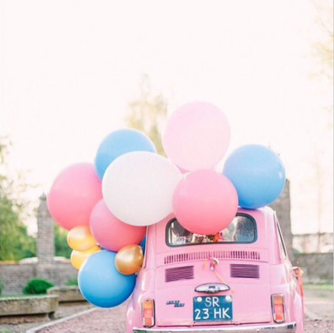 Pink car full of balloons for fun car journeys with Kids on the Little Hotdog Watson blog