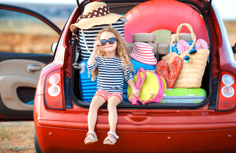 Kids sat in boot of car