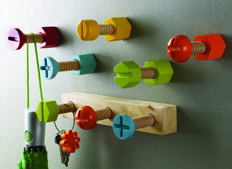 Brightly coloured wooden screw shaped clothes hooks as featured on Little Hotdog Watson blog