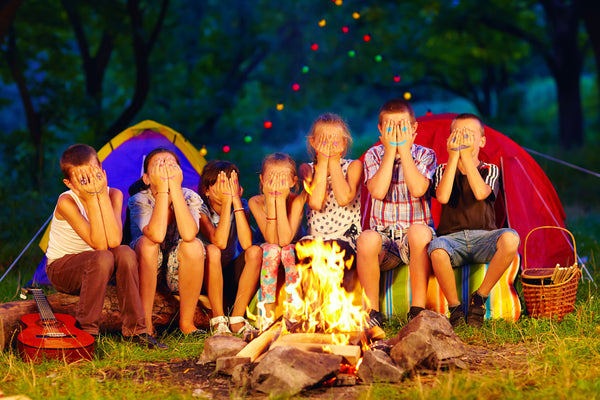 Kids Camping by a Campfire After Dark