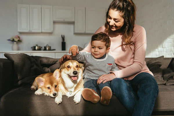 Mother and son petting their dogs