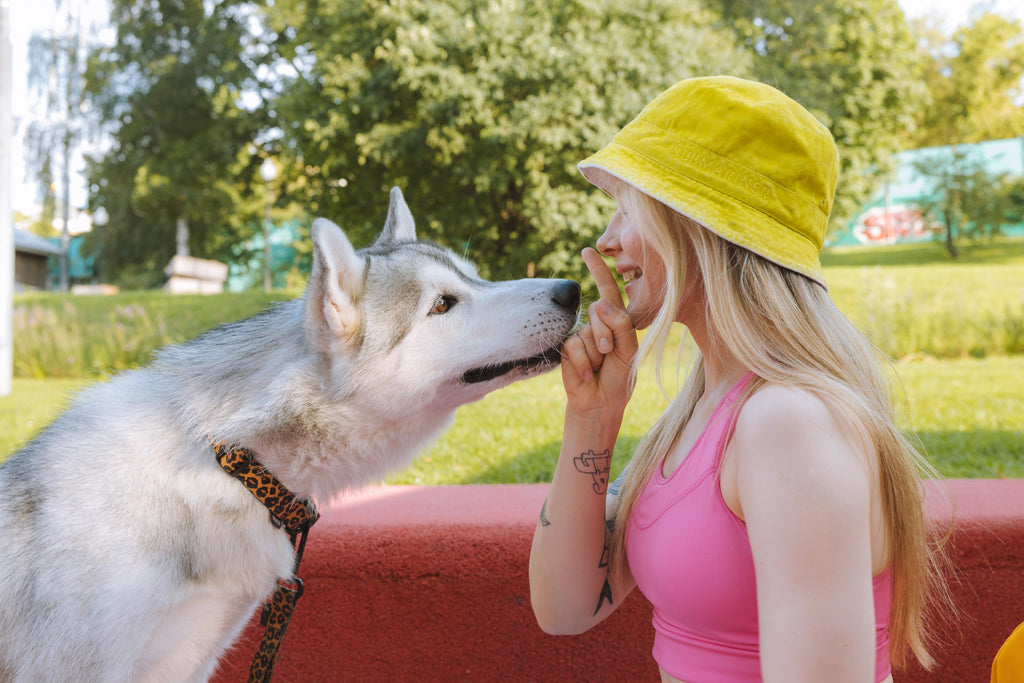 Woman with her dog outdoors.