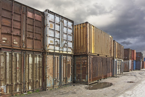 Rusty shipping containers in a yard