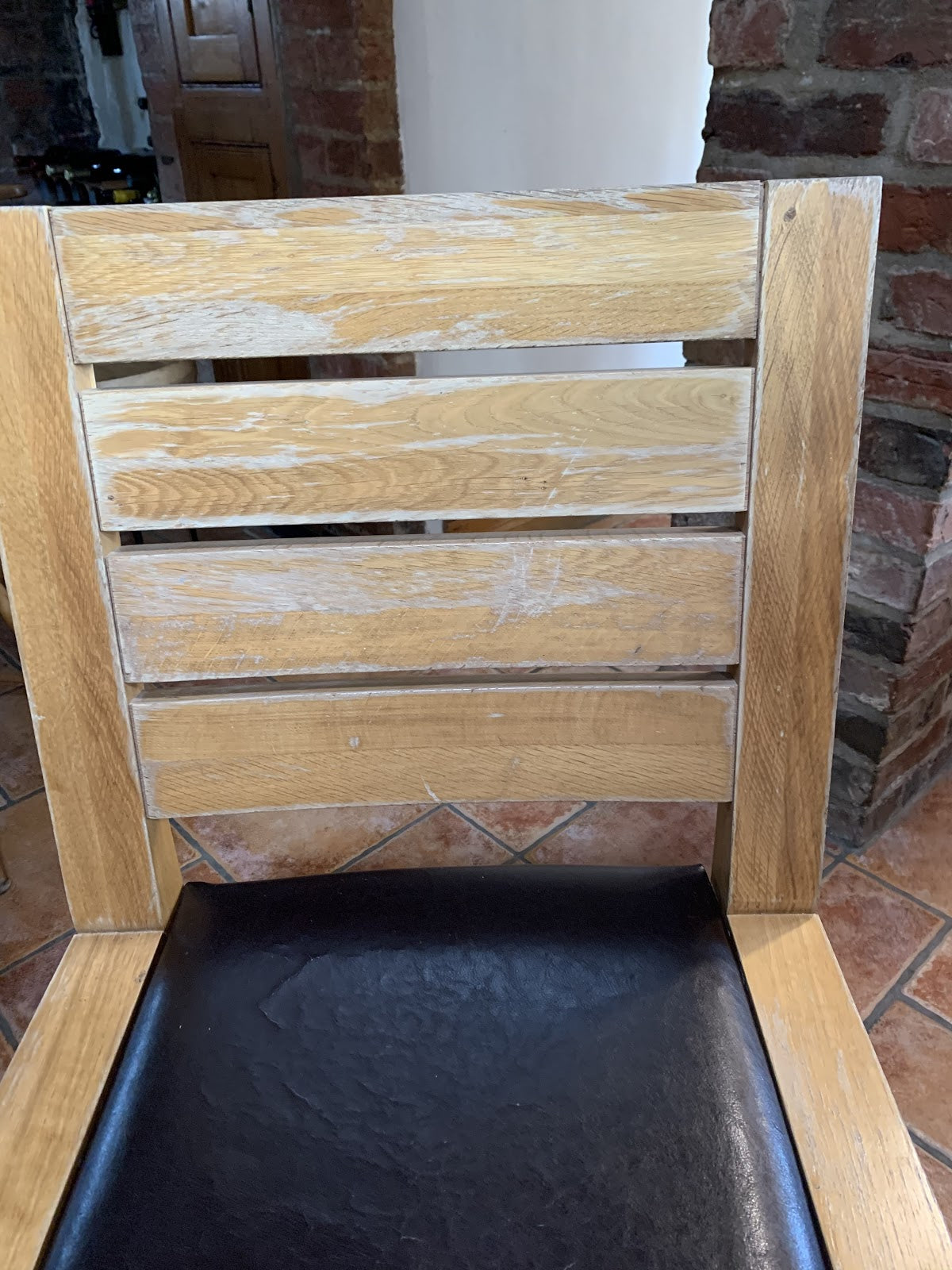 a typical example of a degraded and broken wood finish the broken-down finish on wooden chairs