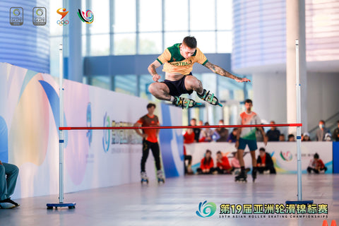 Jesse-Jumping-Over-Bar-During-High-Jump-Competition