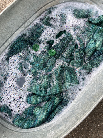 Sweater soaking in soapy water