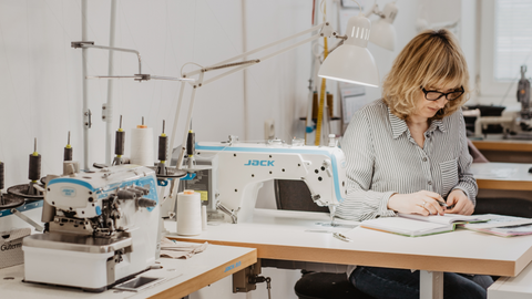 Linen and Letters lady working