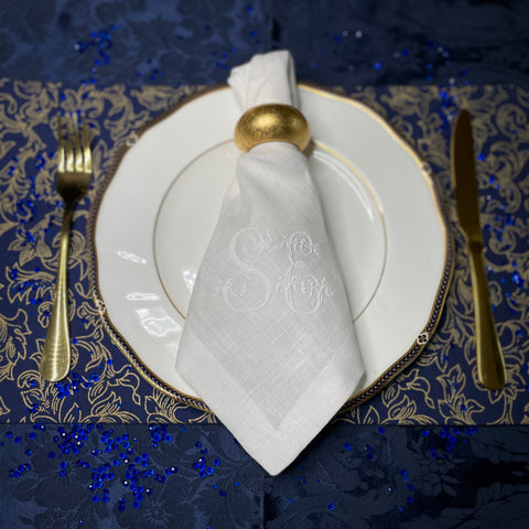 Royal Blue Gold place setting with white linen monogram napkins