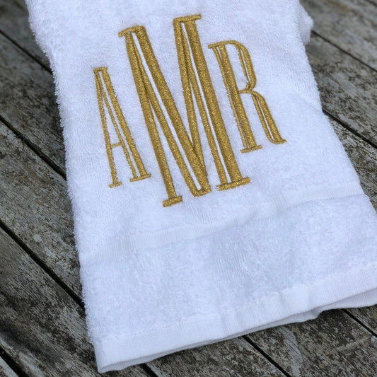 https://cdn.shopify.com/s/files/1/1060/3484/products/gold-embroidered-monogram-white-bathroom-towel-922549.jpg?v=1696777724&width=533