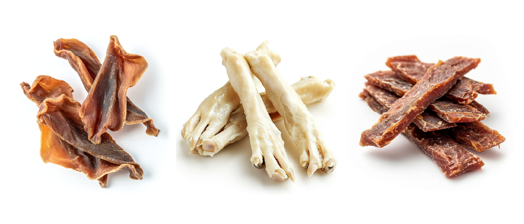 This image features three different types of dog chew treats arranged on a white background. On the left, there are pig ears, recognizable by their unique shape and brownish color, which are popular for their chewy texture. In the middle, there are chicken feet, pale and elongated with a distinctive claw at one end, often given to dogs for their crunchy texture and dental benefits. On the right side of the image, there are strips of venison chews, dark in color and with a jerky-like appearance, known for being high-protein and low-fat treats suitable for dogs. The arrangement showcases a variety of textures and types of chews that cater to different canine preferences.