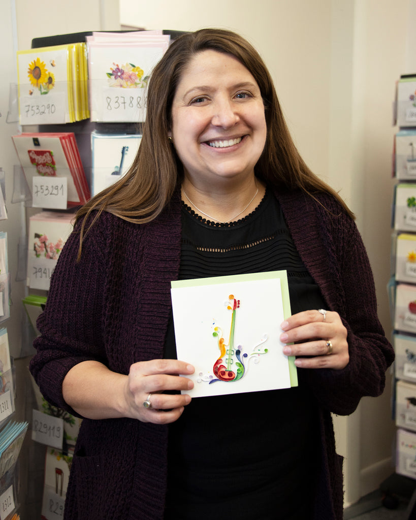Woman holding a Quilled Electric Guitar Greeting Card