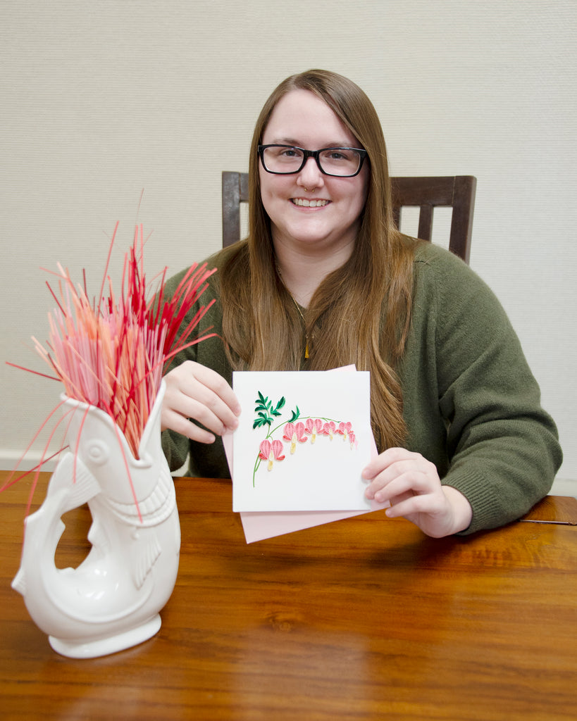 Woman holding the Quilled Bleeding Heart Greeting Card