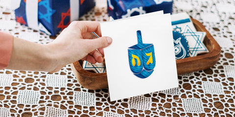 Wish your Jewish friends a Happy Hanukkah with the Dreidel greeting card.