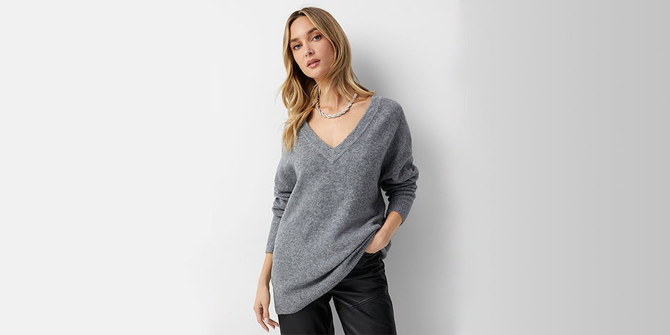 a women wearing dark grey sweater