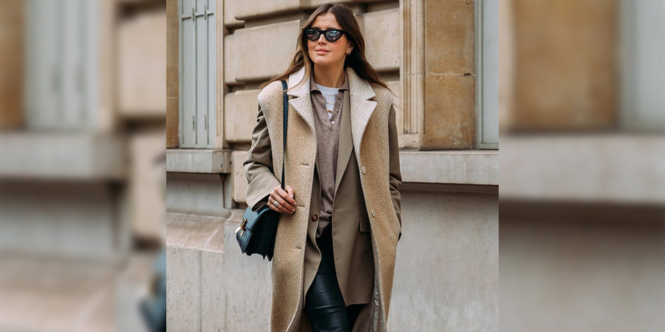 girl wearing brown cardign with purse in her hand