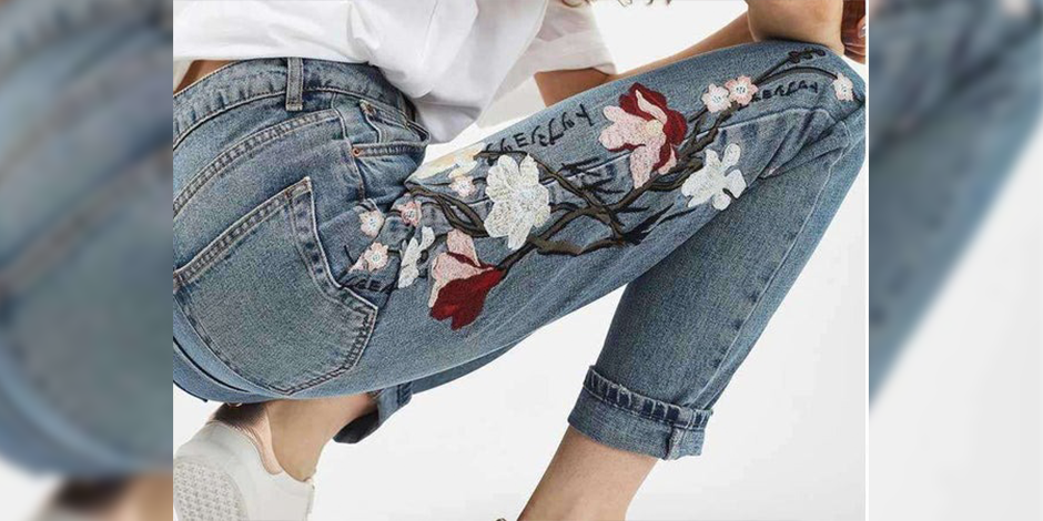 women wearing jeans with flower design on it