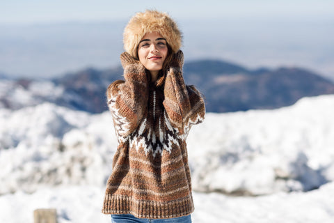 women smiling wearing sweater