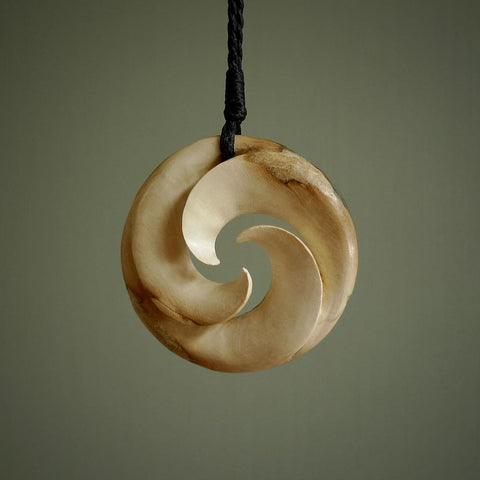 Woolly Mammoth tusk pendant. Hand carved by NZ Pacific. Handmade jewellery for sale online.