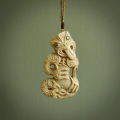 Hand carved wheku tiki pendant made fro deer antler