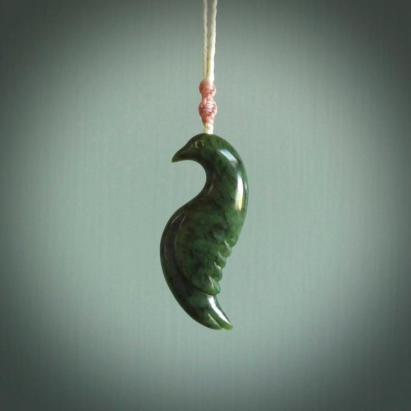 This pendant is a hand carved contemporary bird pendant. Carved in nephrite jade. It is a finely shaped piece with gentle and soft lines and is a great representation of the peace that doves traditionally represent. We ship these worldwide with DHL express courier. A fantastic and meaningful gift.