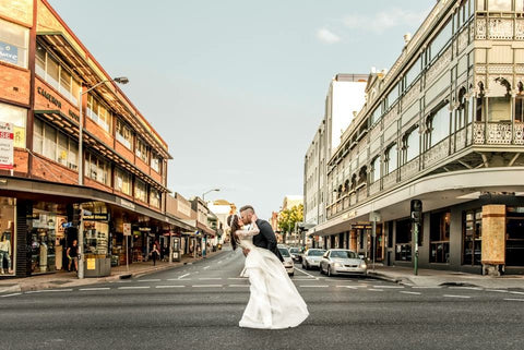 Image of bride and groom in a romantic embrace.