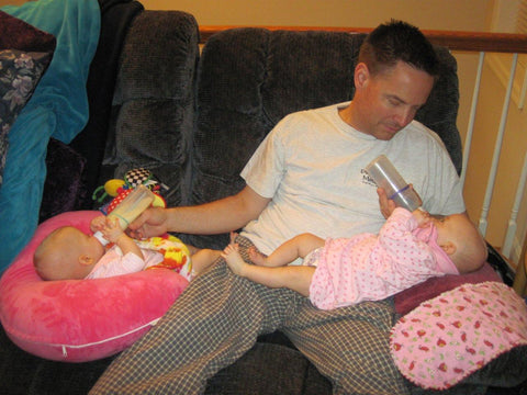 dad feeding twins