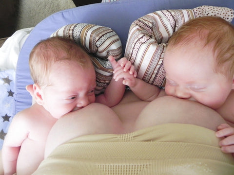 Mom breastfeeding twins