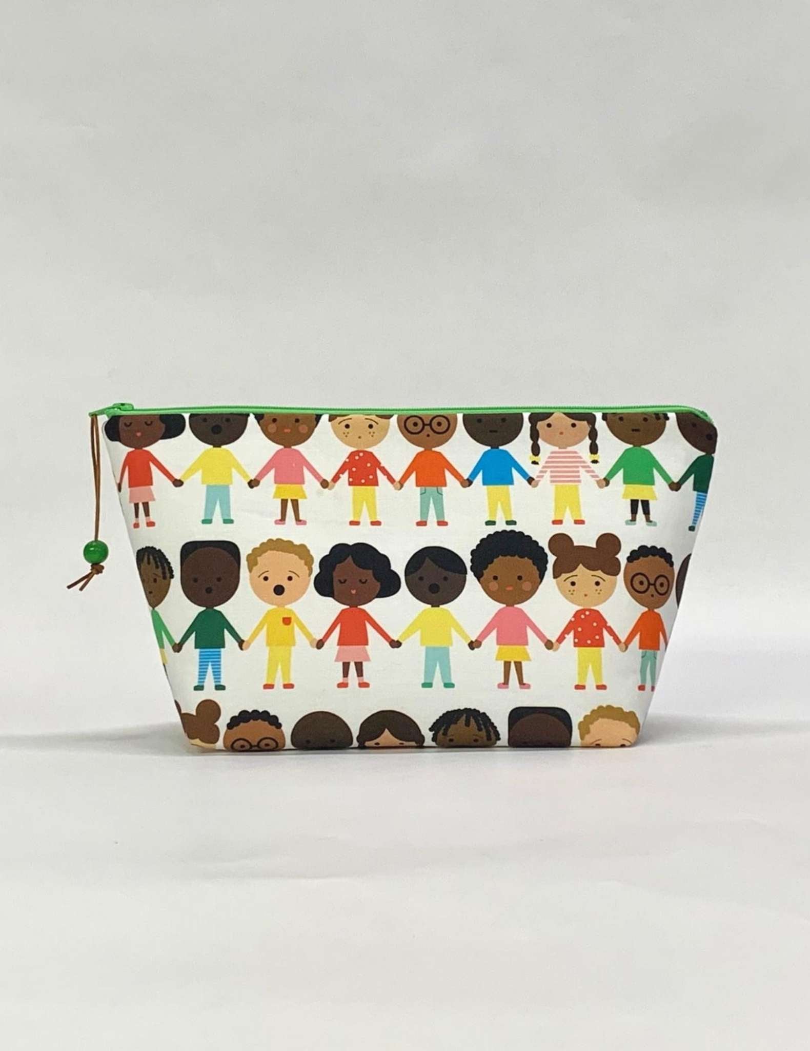 A project bag with zip made in a fabric showing drawings of people of different skin colours holding hands