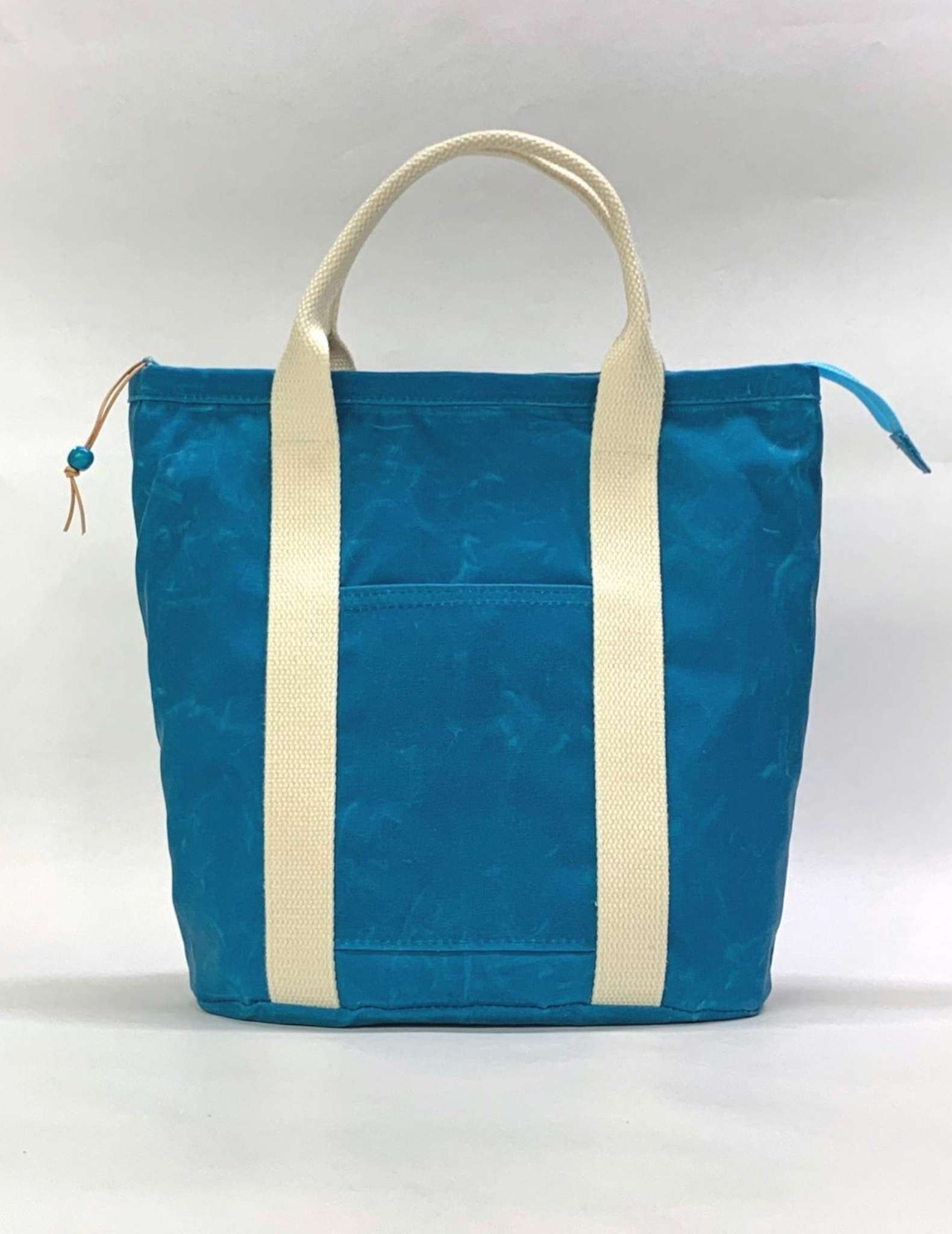 A blue and white waxed canvas knitting bag