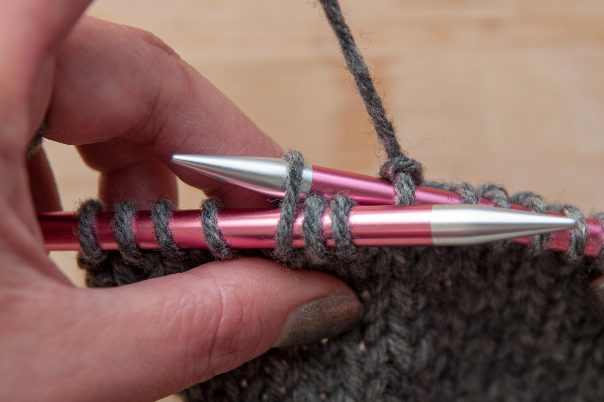 Insert right needle into the back of the third stitch on the left needle.