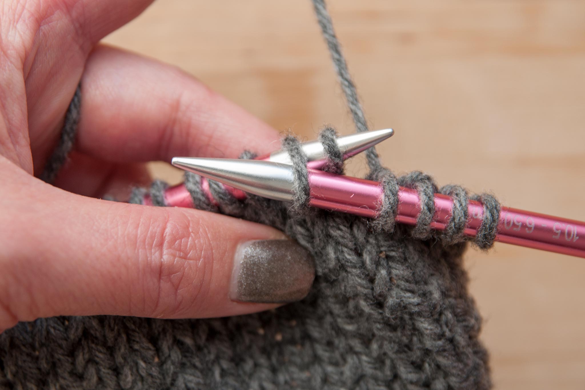Insert the right needle tip into the front of the 2nd stitch on the left needle.