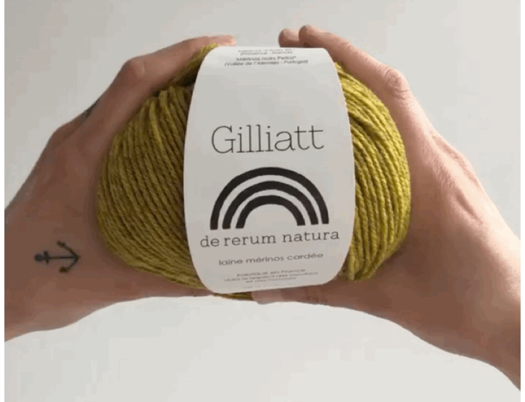 gif off a ball of chartreuse gilliatt being squished by two white hands