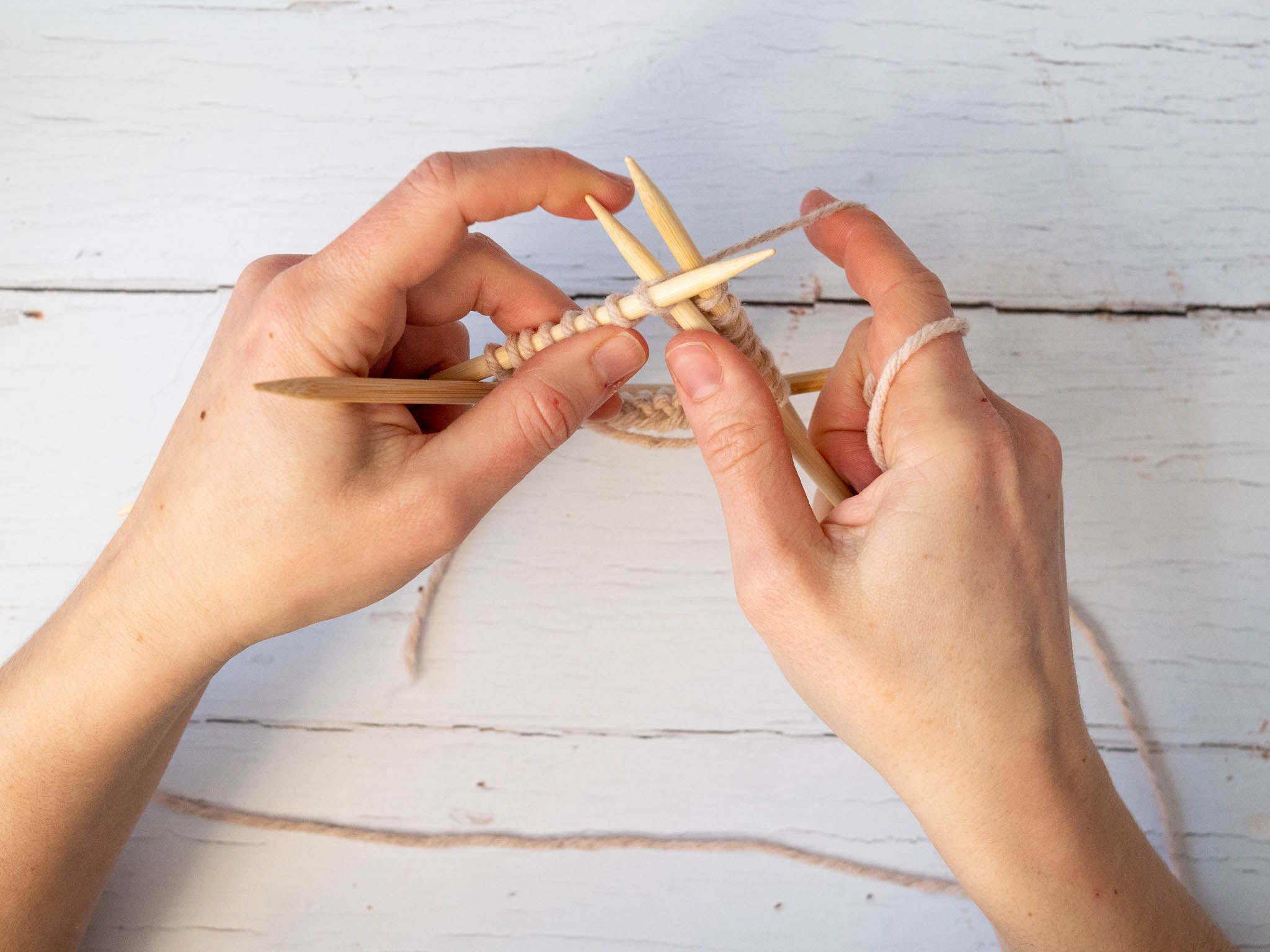 knitting into the first stitch on the next needle