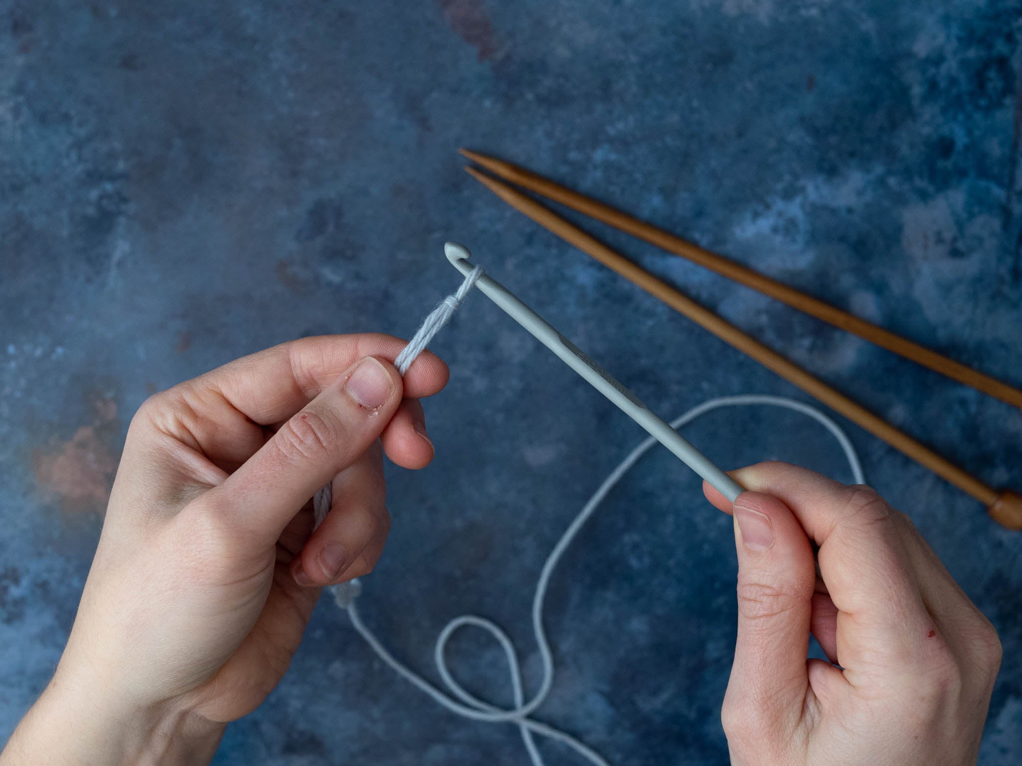 Place slipknot onto the crochet hook and tighten.