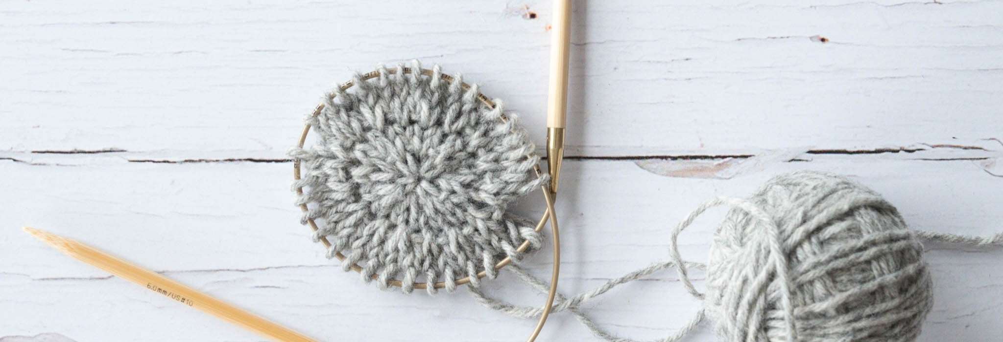 close up of a small circle of grey knitting