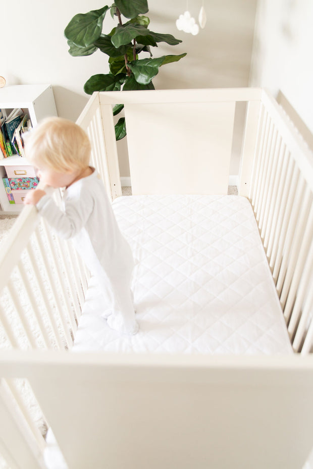 crib sheet saver pad