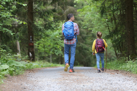 Dad hiking with kid