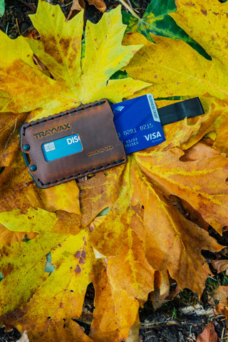 Ascent Wallet displayed on yellow fall leaves