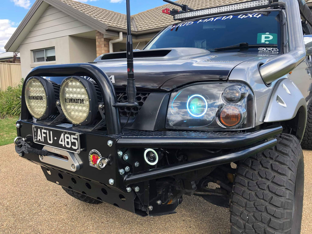 Nissan Navara D22 headlights with multicolored halo rings