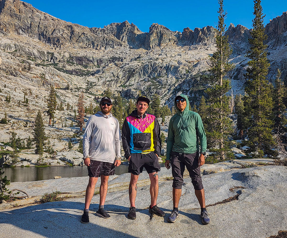 HIkers standing below Alta peak at Emerald Lake 