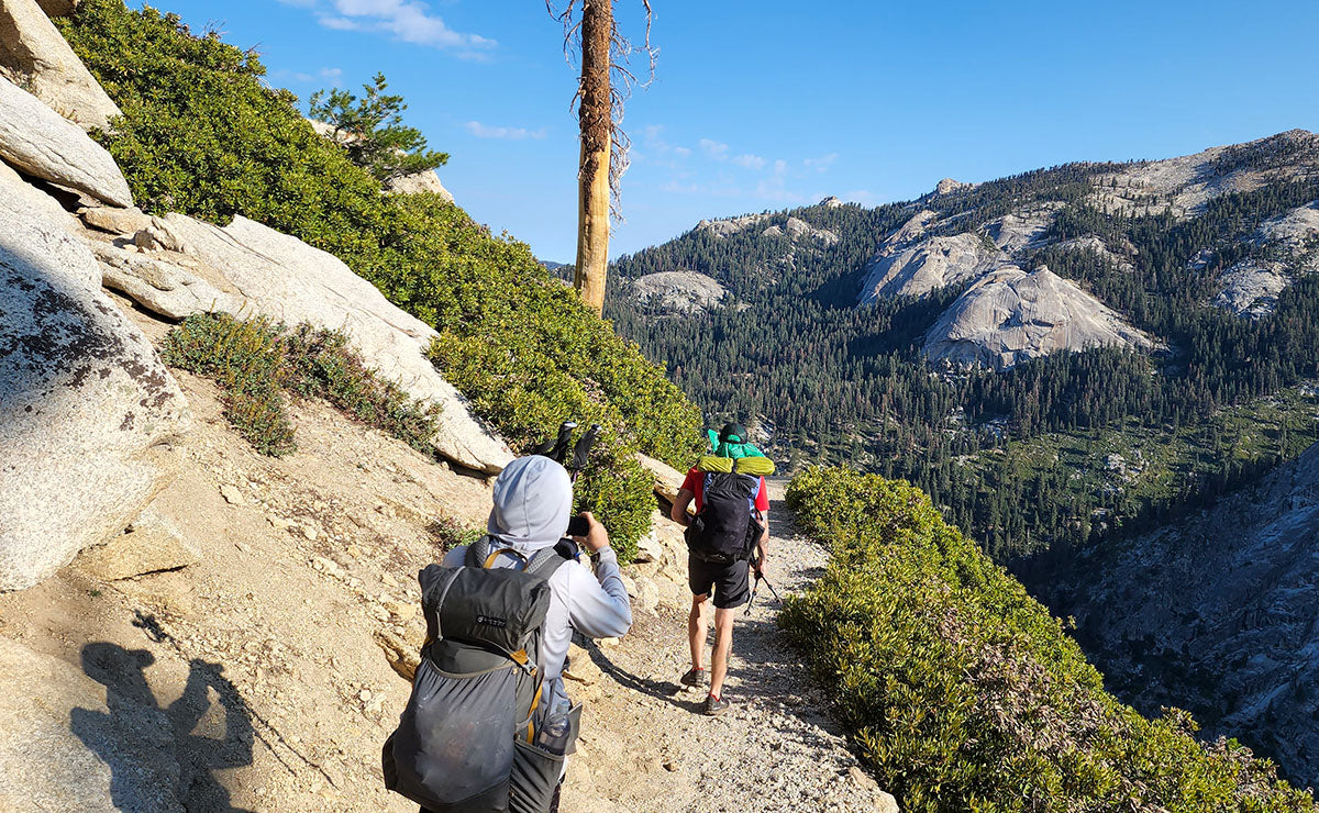 Backpacker on Watchtower trail, Overlooking Canyon