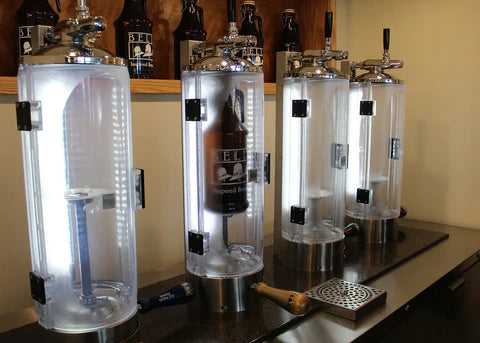 Pegus growler filling machines in the process of filling a glass beer growler
