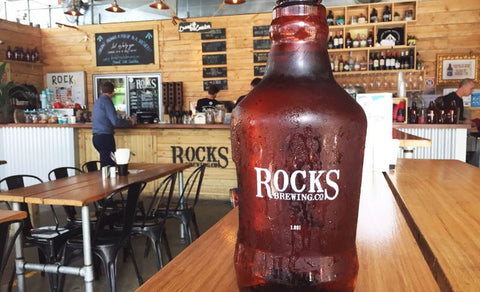 PET (plastic) beer growler from Rocks brewing in the brewery on a table