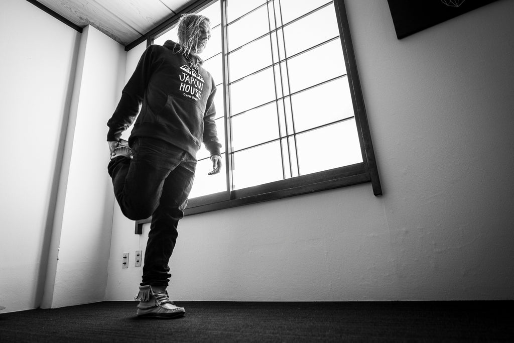 Mark Abma stretching before a big day in the Japanese Alps with photographer Eric Berger and Red Bull skier and HANAH Hero Michelle Parker